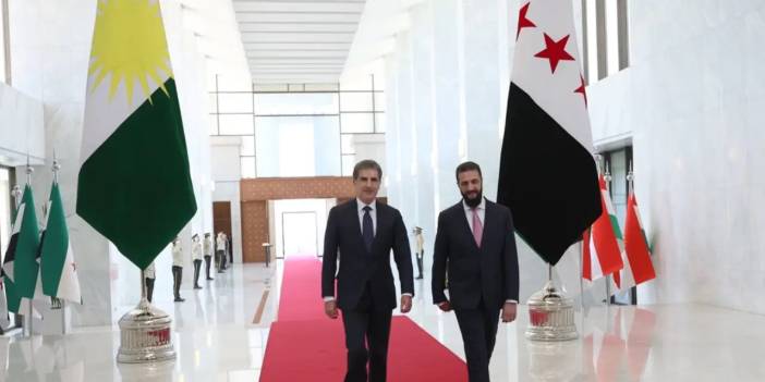 Şara, Barzani’yi Şam’da dev Kürdistan Bölgesi bayrağıyla karşıladı